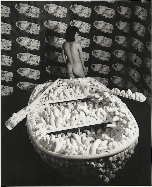 Yayoi Kusama posing in Aggregation: One Thousand Boats Show, 1963