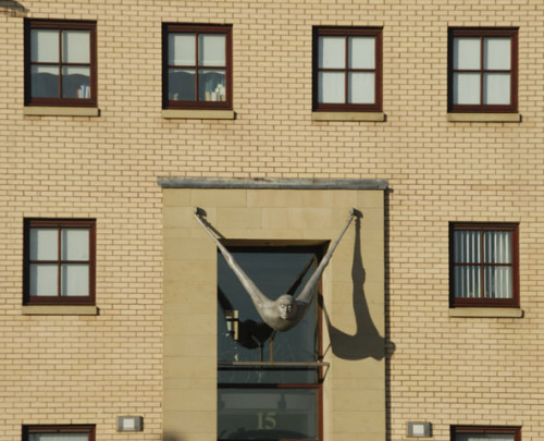 Hanging umans adorn New Gorbals Housing Estate